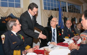 Gov. Malloy congratulates William Schietinger (with Gerald Schaffer, left & george Thompson, right)